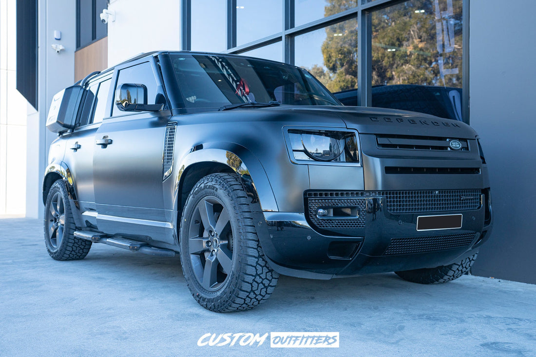 Gloss black side cargo box on Land Rover Defender
