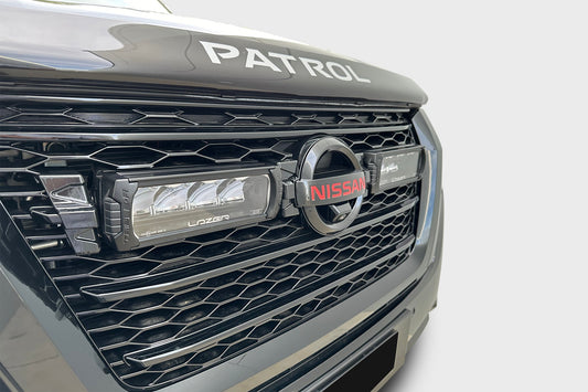 Black mesh grille with integrated lights on a Nissan Patrol Y62 Series 5